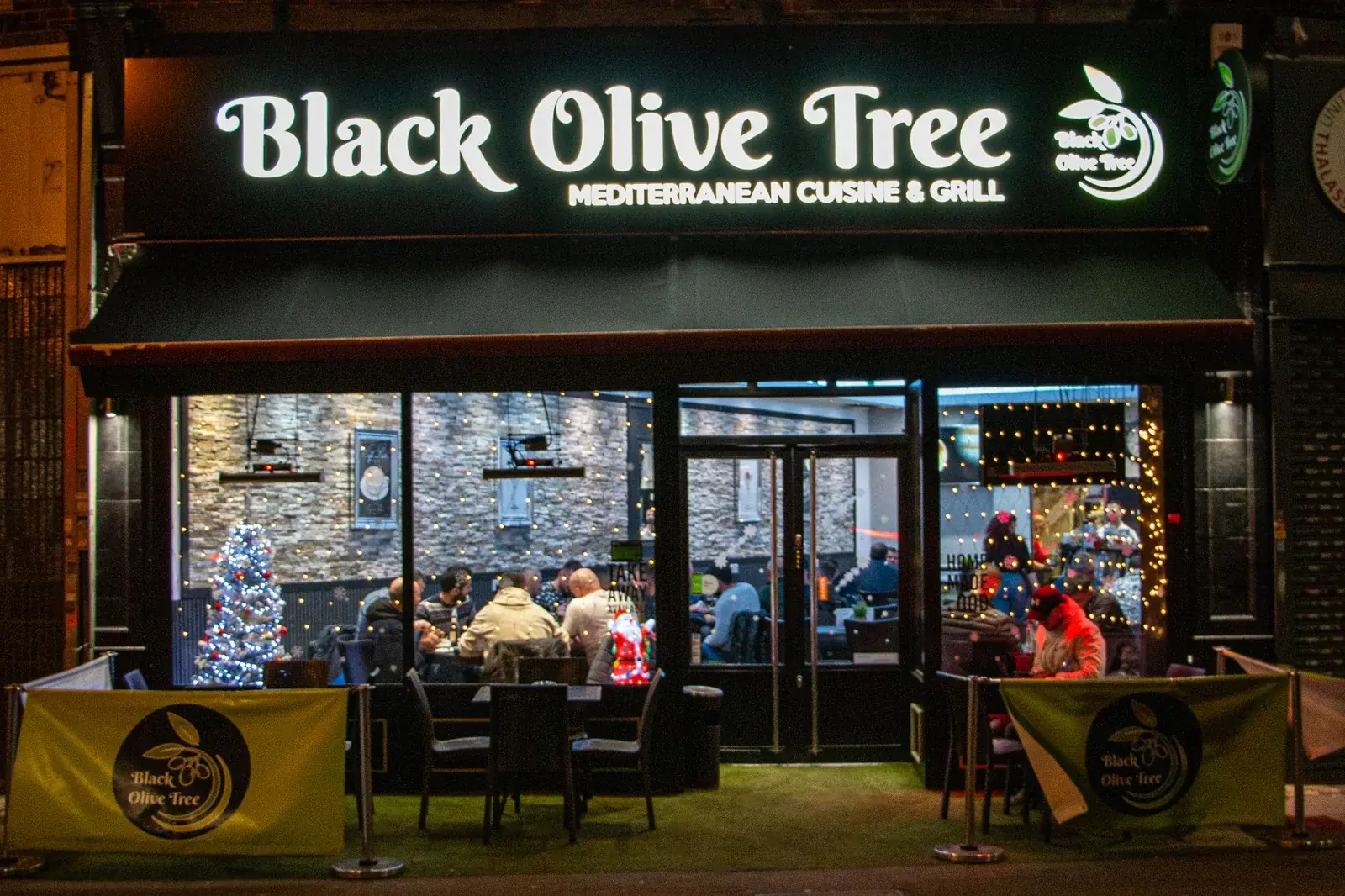 The previous green Black Olive Tree shopfront