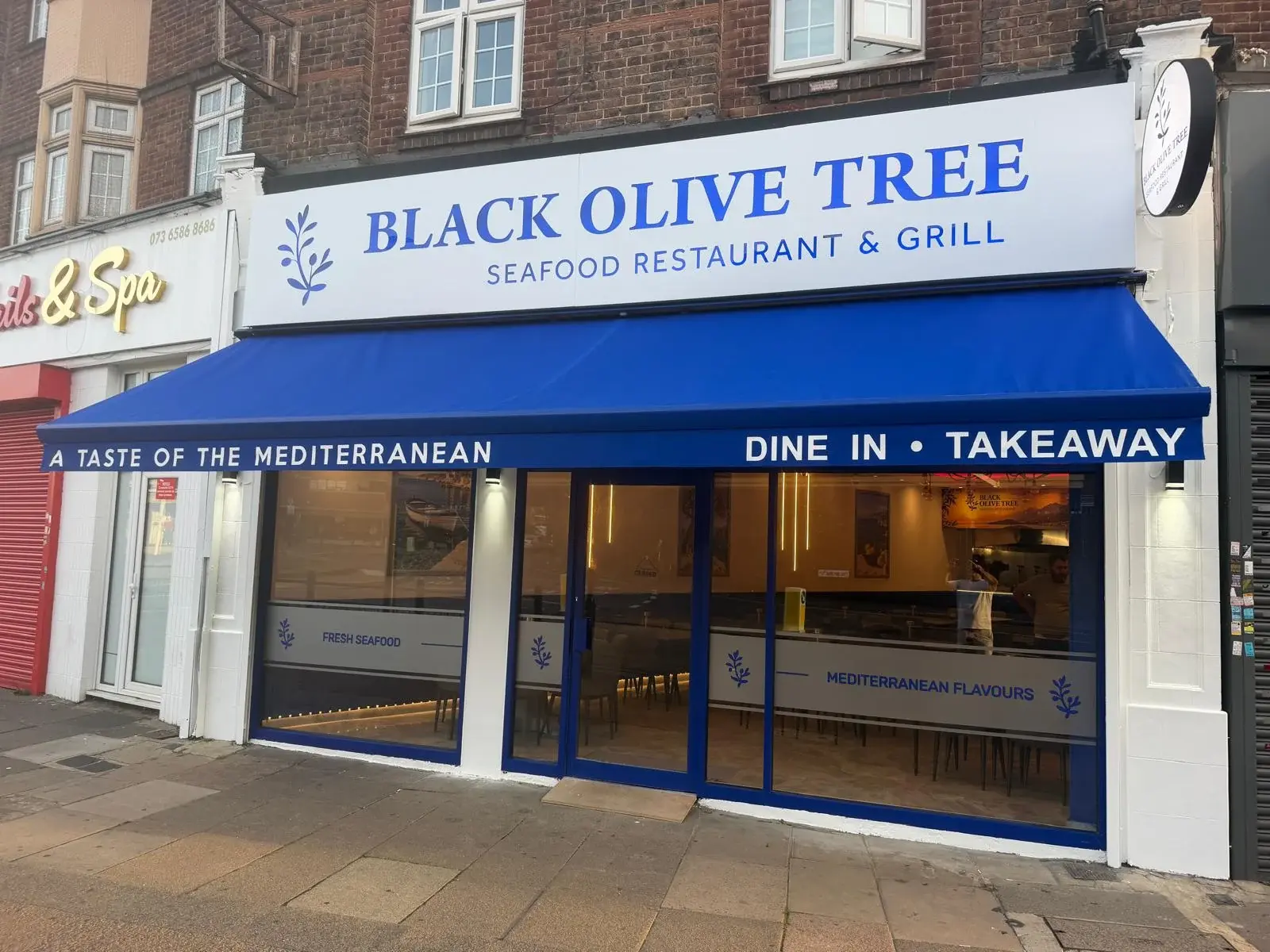 The new blue Black Olive Tree shopfront